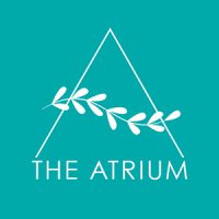 A white outline of a triangle with a branch inside, above the text "THE ATRIUM" on a teal background.